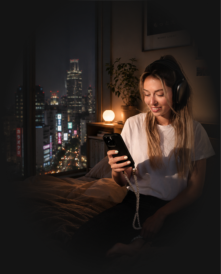 Her alone in Tokyo – headphones on, the shared list open
